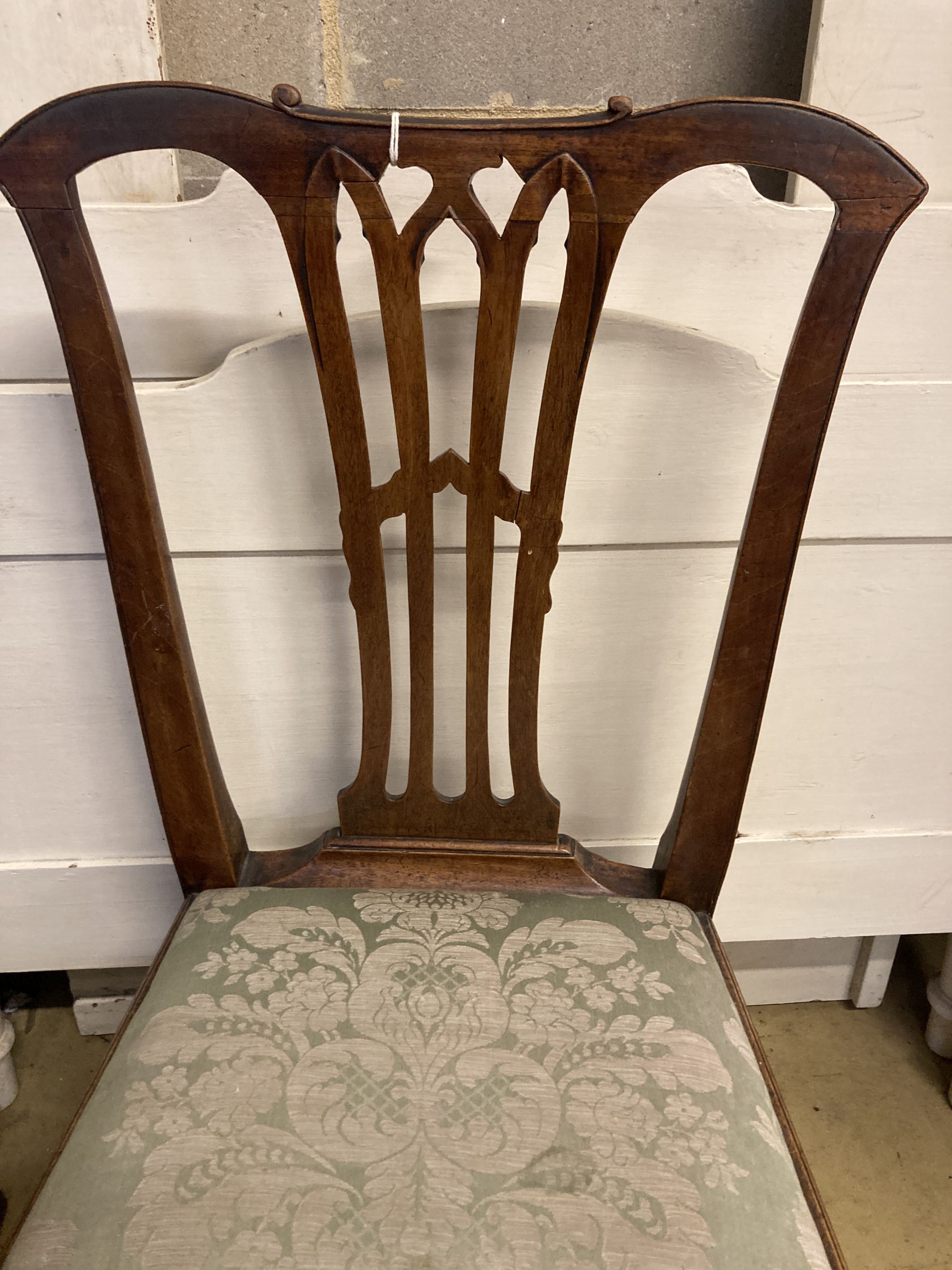 A 19th century Chippendale design mahogany dining chair, with pierced splat back over a drop in set and square underframe